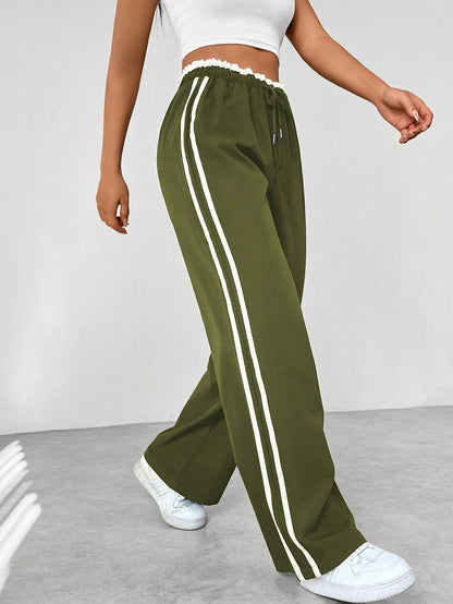 Vrijetijdsbroek voor dames: sportieve wide-leg broek met trendy strepen, ideaal voor casual gelegenheden.